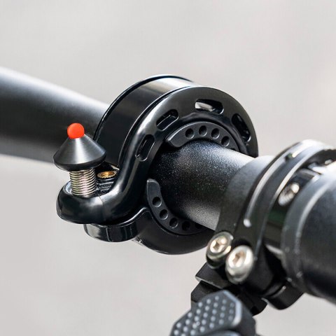 Dzwonek rowerowy w kształcie litery Q 100db - czarny Dzwonek rowerowy w kształcie litery Q 100db - czarny